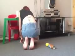 As my long-legged girlfriend cleans the living room, she shows her trousers.